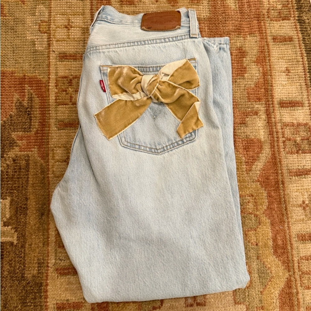Vintage Levi's 501 Light Wash Jeans with Gold Bow Accent